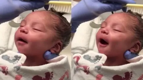 Newborn Baby Delights in Having Her Hair Washed, Enjoying Every Moment