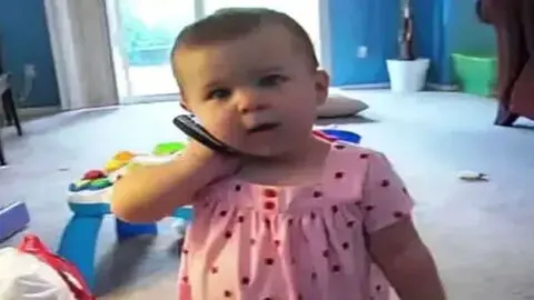 She Enjoys Chatting with Her Dad on the Phone